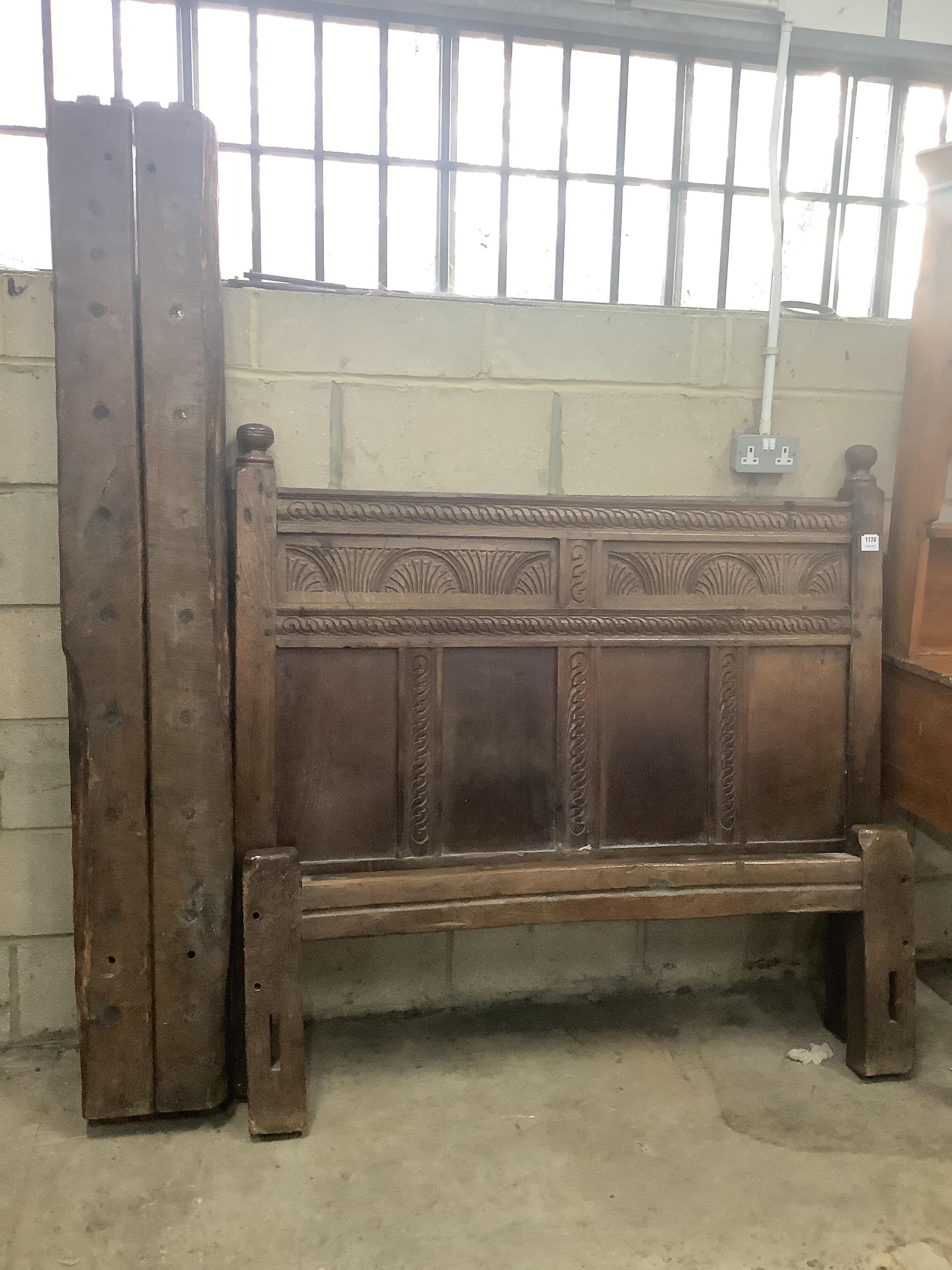 A 17th century style carved oak bedstead, width 137cm